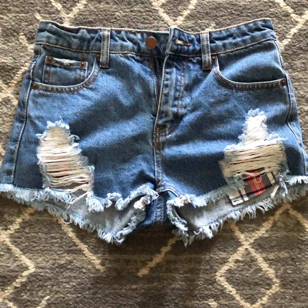 Denim cut off shorts with plaid pocket detail